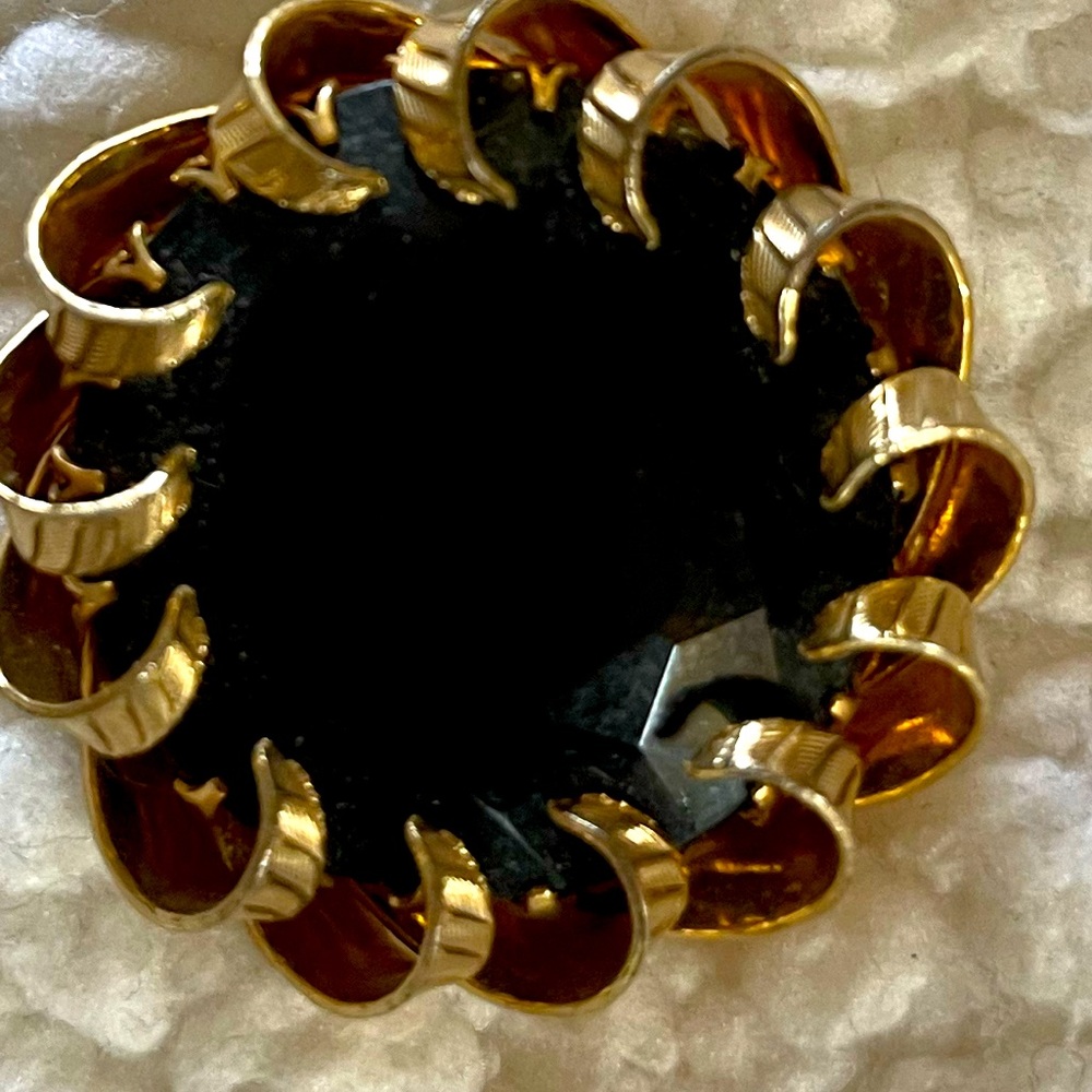 Black onyx broach and pendant.
